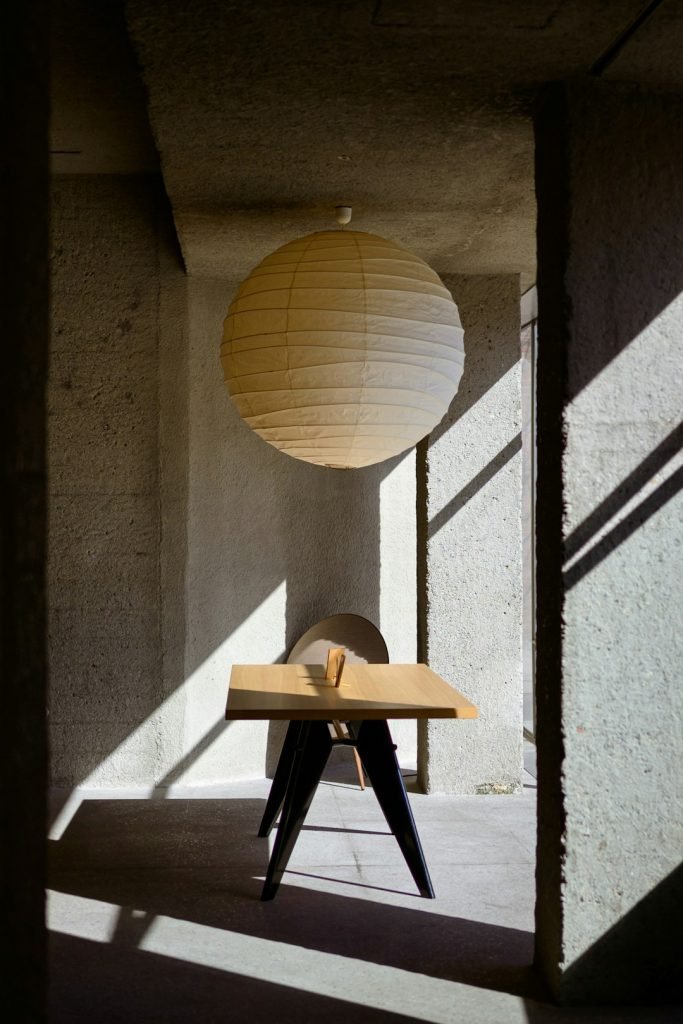 a-table-with-a-paper-lantern-on-top-of-it-m0uq4gdmed4